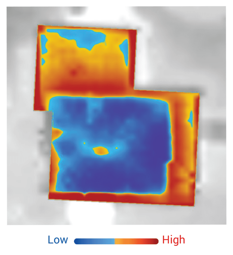 An aerial thermal heat loss map of a home, showing heat loss depicted on a blue to red scale