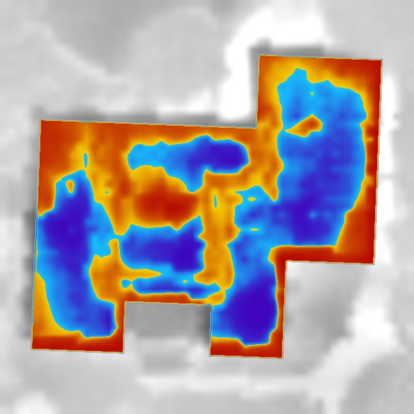An aerial thermal heat loss map of a home depicting areas of high heat loss in red and low heat loss in blue