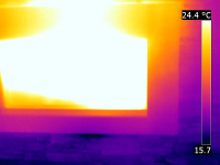 A FLiR thermal image of a fireplace inside a home