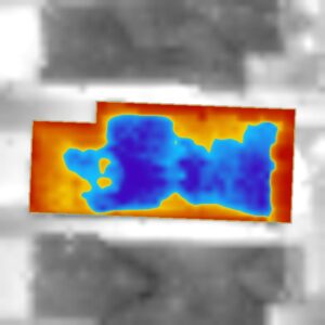 An aerial heat loss map of a home showing areas of heat loss in red and blue