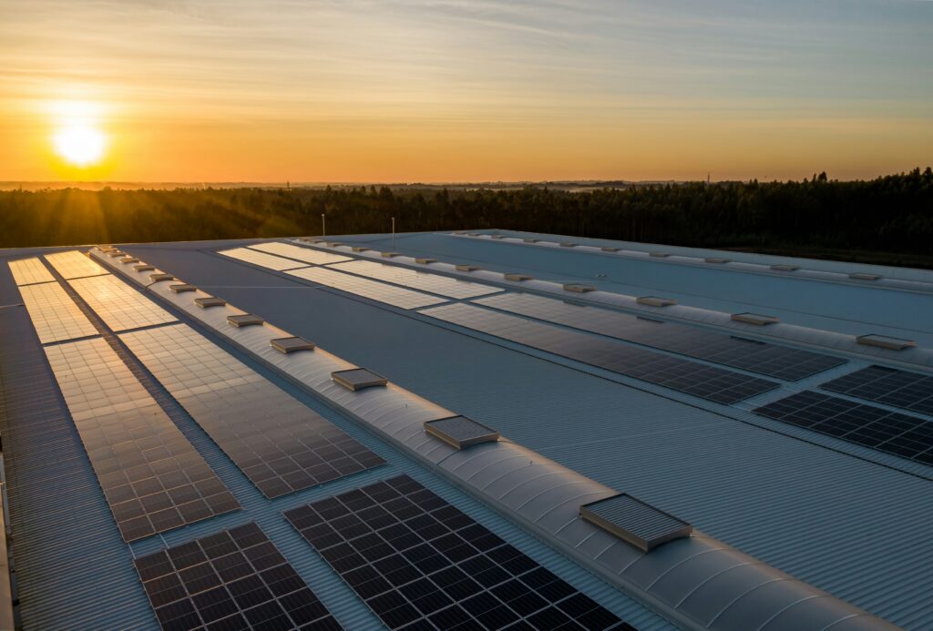Sunset over a roof with solar panels installed