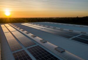 Sunset over a roof with solar panels installed